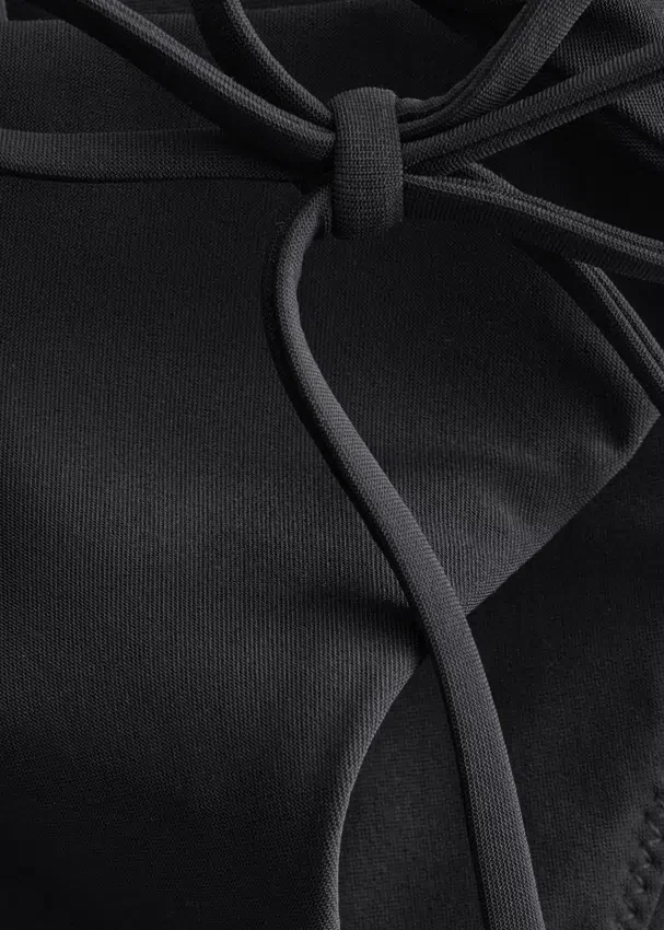Bikini-Slip mit seitlichen Bändern Bikini-Slip mit seitlichen Bändern