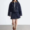 Kurze Jeansjacke mit Cordkragen