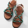 Ledersandalen mit Perlenverzierung