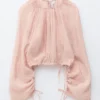 Voluminöse Bluse mit Bindedetails